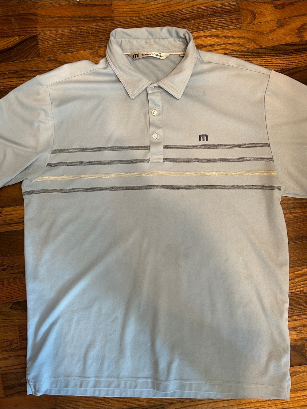 Travis Mathew Light Blue Polo with Gray and Silver Chest Stripes